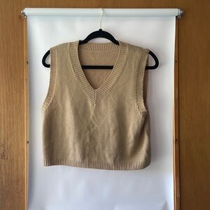 Tan sweater vest. Slightly cropped